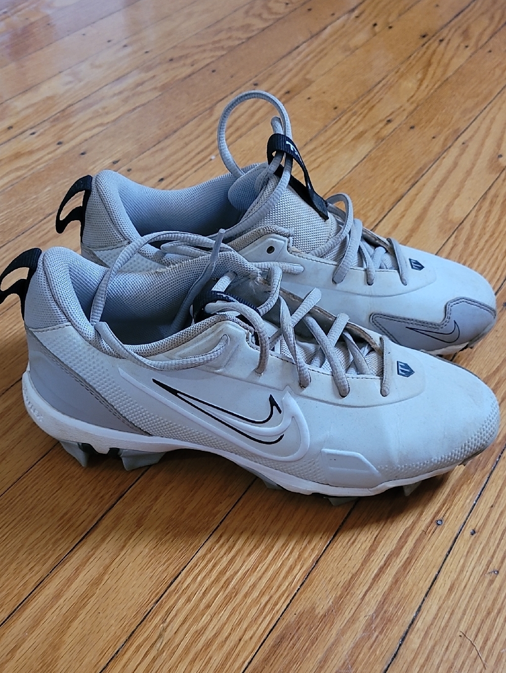 Nike White and Light Gray Baseball Cleats with Black Swoosh